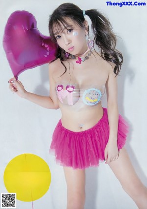 A woman in a bikini and high heels posing for a magazine.